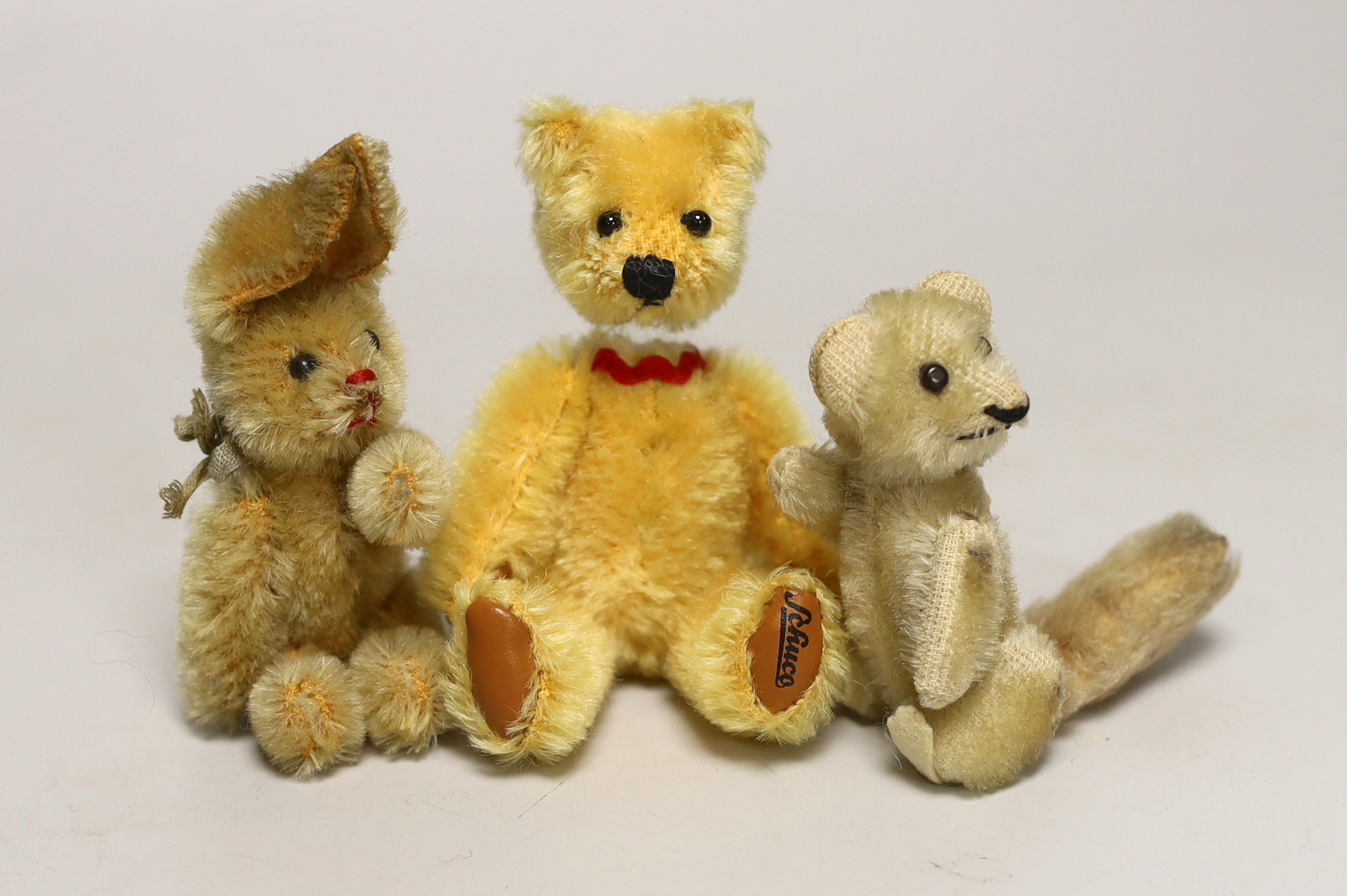 A modern Schuco scent bottle bear, 5in., a Schuco rabbit, 3in., and a Schuco possum